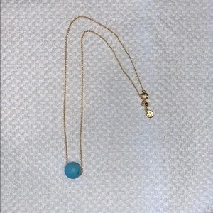 Gorjana adjustable gold necklace with a blue stone